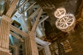 Wieliczka Salt Mine underground wooden balk structure with chandelier made from salt, Krakow, Poland, tourist landmark Royalty Free Stock Photo