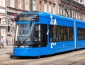 Krakow, Poland, blue Krakowiak tram, vehicle front closeup, modern public transportation, city transport, commute, MPK tramway