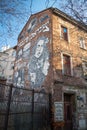 Krakow, Poland - December 13, 2019: Black and white mural street art on a brick wall by unidentified artist in the jewish