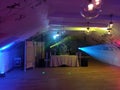 Krakow, Poland: An empty dance floor with illuminated colorful disco spot lights. ready for a dance party and