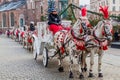 KRAKOW, POLAND - DECEMBER 2, 2017: Old-fashioned Horse drawn carriages at Rynek Glowny square in Krakow, Pola