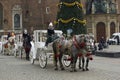 Krakow, Poland : Queue of horse ride carriage for tourists during christmas eve holidays in winter at city Royalty Free Stock Photo