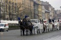 Krakow, Poland - December 16, 2014: Queue of horse ride carriage for tourists during christmas eve in winter Royalty Free Stock Photo