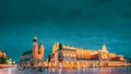 Krakow, Poland. Evening Night View Of St. Mary's Basilica And Cloth Hall Building. Famous Old Landmark Church Of Our Royalty Free Stock Photo