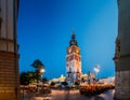 Krakow, Poland. Famous Landmark On Old Town Square In Summer Evening. Old Town Hall Tower In Night Lighting. UNESCO Royalty Free Stock Photo