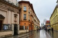 Krakow, Poland - February 23, 2016: Street of old Krakow in rainy evening, Krakow, Poland. Royalty Free Stock Photo