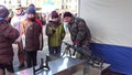 KRAKOW, POLAND - JANUARY, 14, 2017 Polish guard demonstrates machine gun to a little boy. WOSP military show Royalty Free Stock Photo