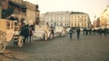 KRAKOW, POLAND - JANUARY, 14, 2017 Retro horse drawn carriages and Old town street, warm colors Royalty Free Stock Photo