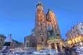 KRAKOW, POLAND - JUL 3: View of Kosciol Mariacki in market square on Jul 3, 2017 in Krakow, Poland. Church of Our Lady Assumed in Royalty Free Stock Photo