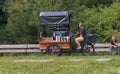 Miniature dryp mobile cafe with three wheels in a city park. Royalty Free Stock Photo