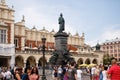 KRAKOW, POLAND - July 21, 2019: ourists walking on market near monument of the poet Adam Mickiewicz