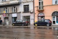 Krakow, Poland - July 18, 2020: Two cars locked with clamped vehicle wheel lock by the street in Europe