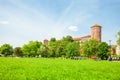 KRAKOW, POLAND - JUNE 08, 2016: Lots of people walking near historical complex of Royal Wawel Castle with well seen Sandomierska t