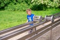 KRAKOW, POLAND - JUNE 17: Museum of Science in the open air. Park. The boy is studying physical laws. STEM education. Back to