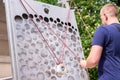 KRAKOW, POLAND - JUNE 17: Museum of Science in the open air. Park. Man tries to bring the balls from the beginning to the end of Royalty Free Stock Photo