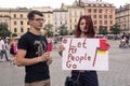 Krakow, Poland, June 01, 2018, A young girl and a guy with a poster protesting against political prisoners in Russia, Let my