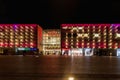 Beautiful and colorful glowing facade of Krakow shopping mall over main railway station at dark