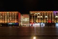 Beautiful and colorful glowing facade of Krakow shopping mall over main railway station at dark