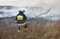 KRAKOW, POLAND - MARCH 11, 2018: Firefighters fight with fire in the meadow