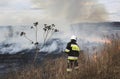 KRAKOW, POLAND - MARCH 11, 2018: Firefighters fight with fire in the meadow