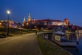 Krakow, Poland - 14 March, 2022: Wawel hill with castle in Krakow at night Royalty Free Stock Photo