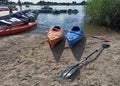 Krakow, Poland: Wide angle shot of couple of kayak for rent kept at dock with it`s paddle in the man made lake