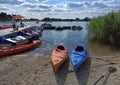 Krakow, Poland: Wide angle shot of couple of kayak for rent kept at dock with it`s paddle in the man made lake