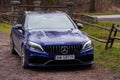 Krakow, Poland 19.02.2020: New luxury sport car Mercedes-benz C-class C63 AMG W205 blue color, parking in city park Royalty Free Stock Photo