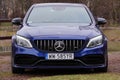 Krakow, Poland 19.02.2020: New luxury sport car Mercedes-benz C-class C63 AMG W205 blue color, parking in city park. Detail front