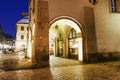 KRAKOW, POLAND - NOVEMBER 24, 2015: City center by night: ancient temements. Maly Rynek square Royalty Free Stock Photo