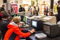 KRAKOW, POLAND, October 13, 2017 Many people play for old computers old video games, side view Royalty Free Stock Photo