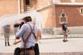 The photographer takes pictures of the bride