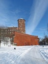 KRAKOW, POLAND, 2021 - Sandomierska Tower of the Wawel Castles and red brick wall underneath. Royalty Free Stock Photo