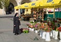 Nun and flowers, Krakow, Poland Royalty Free Stock Photo