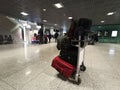 Krakow, Poland: Interior of John Paul II KrakÃÂ³w-Balice International Airport with a passenger suitcase