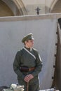 Krakow, Poland - September 23, 2018: nYoung Man dressed in Polish uniforms from World War I among tourists at krakow`s