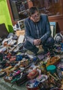 Krakow, Poland - September 21, 2018: Well dressed polish vendor waiting for buyers.He is selling used spare parts and