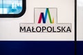 Krakow, Poland - Sign of the Malopolska Polish railway company and a train