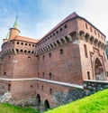 Krakows Barbican on a sunny day. Medieval defensive building fortress. Central entrance doors of famous landmark in old town of