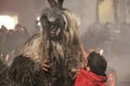 Krampus with a small child