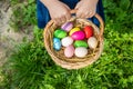 Krashenki homemade eggs in the basket and the hands of a child. Selective focus