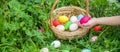 Krashenki homemade eggs in the basket and the hands of a child. Selective focus