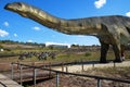 JuraPark dinosaur park, a figure of a brontosaurus and a herd of stegosaurs Royalty Free Stock Photo