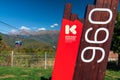 Krasnaya Polyana 960 information sign by cable lift in Krasnaya Polyana mountain ski resort. Scenic blue sky summer landscape,