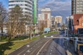 Krasnodar - Kubanskaya naberezhnaya. Cityscape at the beginning of winter. Roads, buildings, cars, infrastructure, sunny weather.