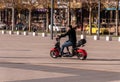 Krasnodar, Russia - December 10 2020: Alternative commute, man hiring and riding on a e-bike in a city park Royalty Free Stock Photo