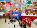 A beautiful interior with customers and a large clock on the wall decorated with Christmas toys in the SBS Megamall shopping cente Royalty Free Stock Photo