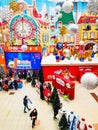 a beautiful interior with customers and a large clock on the wall decorated with Christmas toys in the SBS Megamall shopping cent Royalty Free Stock Photo