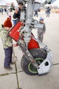 Chassis of a military aircraft. Child at the wheel of the chassis. Su-35 fighter at the air show. Aircraft on the airfield to show