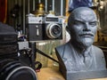 Krasnodar, Russia, July 5, 2019: sculpture of Vladimir Lenin. Old Soviet camera Zenit-E